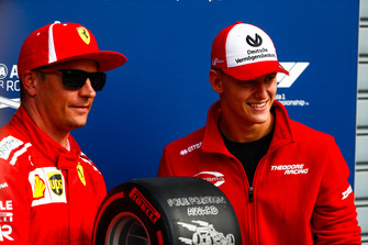 Mick Schumacher presents Kimi Raikkonen, Ferrari, with the Pirelli Pole Position award