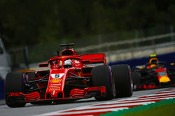 Sebastian Vettel, Ferrari SF71H, leads Max Verstappen, Red Bull Racing RB14