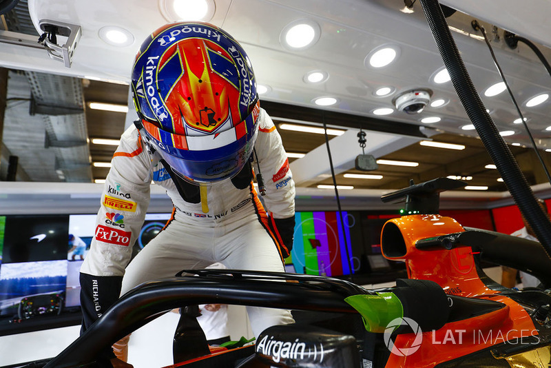 Lando Norris, McLaren, prepares to enter his cockpit