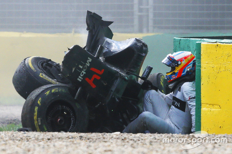 Fernando Alonso, McLaren MP4-31 exits his car after a huge crash