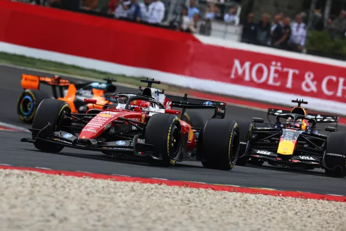 Charles Leclerc, Ferrari; Max Verstappen, Red Bull Racing