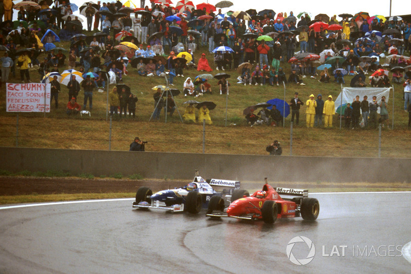 Michael Schumacher, Ferrari F310 forces Jacques Villeneuve, Williams FW18 Renault