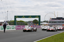 #8 Toyota Gazoo Racing Toyota TS050: Sébastien Buemi, Kazuki Nakajima, Fernando Alonso, #7 Toyota Gazoo Racing Toyota TS050: Mike Conway, Kamui Kobayashi, Jose Maria Lopez cross the finish line