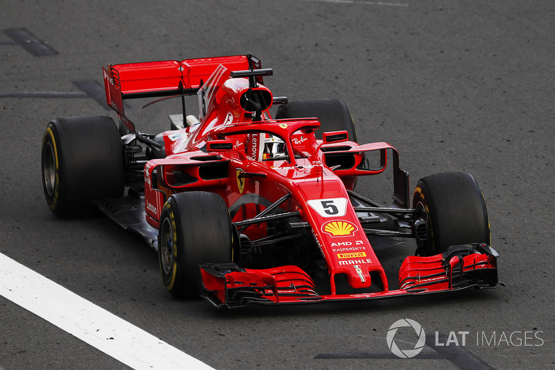 Sebastian Vettel, Ferrari SF71H, punches the air at the finish, after taking victory
