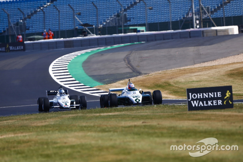 Jenson Button drives a 1982 Williams FW08B, ahead of Guy Martin in a 1983 Williams FW08C