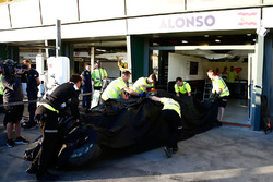 The McLaren MP4-31 of Fernando Alonso, McLaren is recovered back to the pits