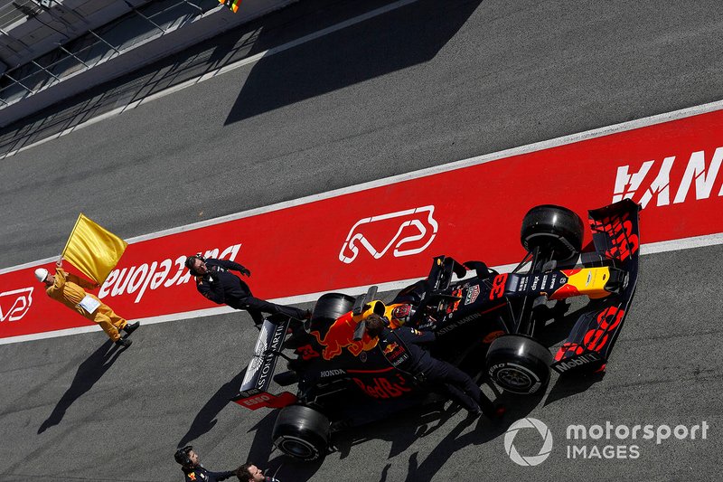 Max Verstappen, Red Bull Racing RB15 stops in the pit lane