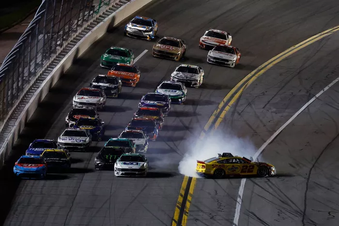 Joey Logano spins from the lead, Team Penske Ford