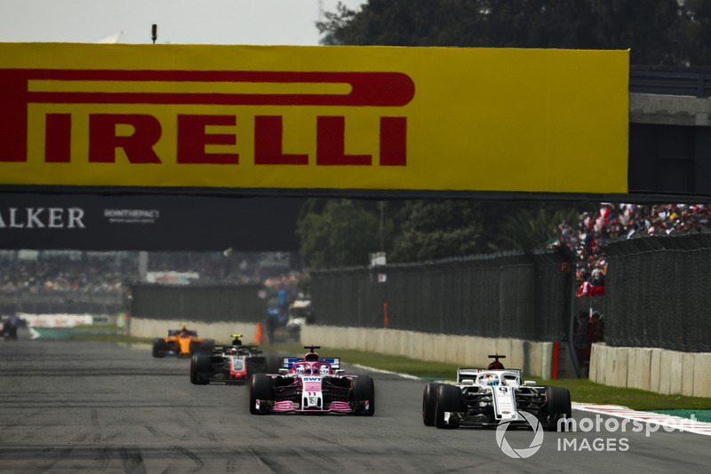 Marcus Ericsson, Sauber C37, leads Sergio Perez, Racing Point Force India VJM11, and Kevin Magnussen, Haas F1 Team VF-18