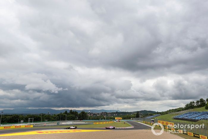 Romain Grosjean, Haas VF-20, leads Lance Stroll, Racing Point RP20