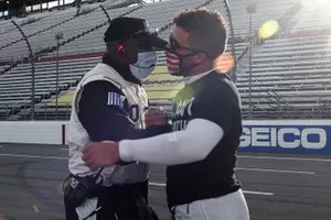 Darrell Wallace Jr., Richard Petty Motorsports, Chevrolet Camaro and a Nascar official