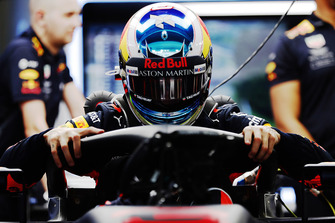 Daniel Ricciardo, Red Bull Racing RB14, climbs in his car in the garage