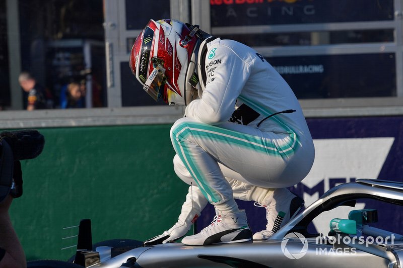 Lewis Hamilton, Mercedes AMG F1, celebrates on his car after securing pole position