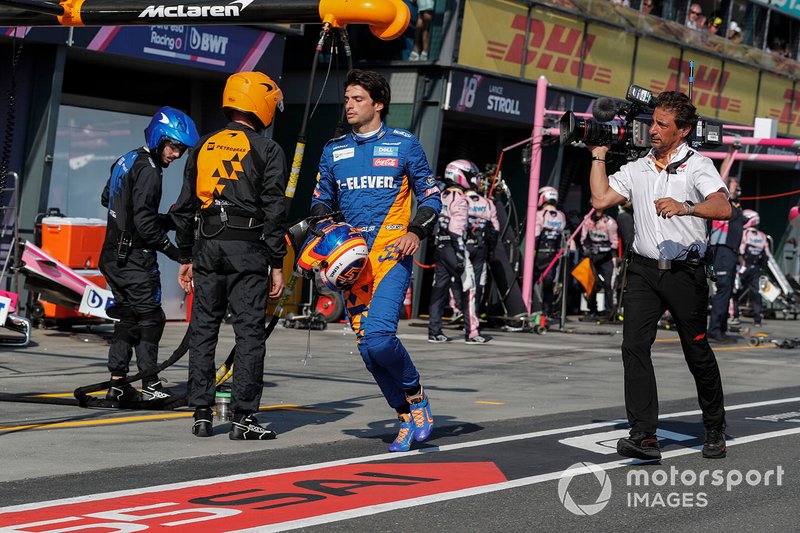 Carlos Sainz Jr, McLaren, heads back to his garage, Jean-Michel Tibi, FOM Cameraman