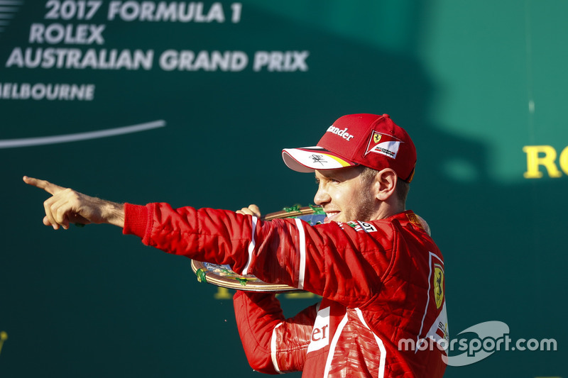 Sebastian Vettel, Ferrari, 1st Position, celebrates with his trophy