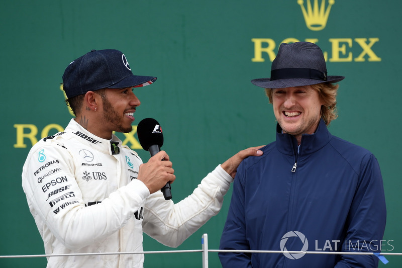 Race winner Lewis Hamilton, Mercedes AMG F1 celebrates and Owen Wilson, Actor on the poidium