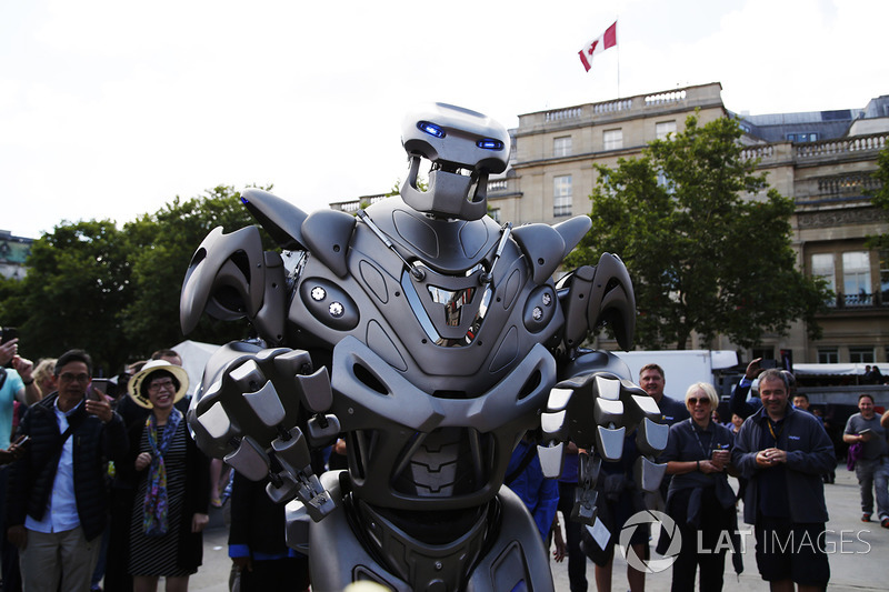 A robotic performer mingles, the crowd