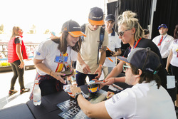 Fernando Alonso, McLaren, signs autographs for fans