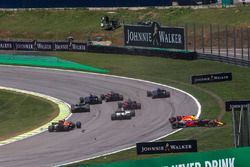 Daniel Ricciardo, Red Bull Racing RB13 and Stoffel Vandoorne, McLaren MCL32 collide at the start of 