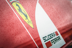 Ferrari logo covererd in hujan drops