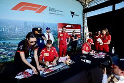 Sebastian Vettel, Ferrari and Kimi Raikkonen, Ferrari at the autograph session