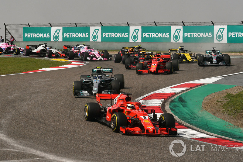 Sebastian Vettel, Ferrari SF71H leads at the start of the race