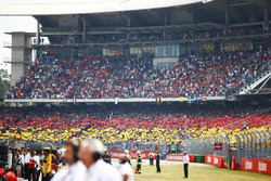 Fans in grandtsands display the German national colours