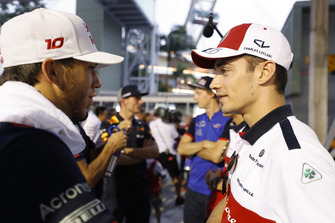 Pierre Gasly, Toro Rosso, talks to Charles Leclerc, Sauber, as behind Max Verstappen, Red Bull Racing, converses to Brendon Hartley, Toro Rosso