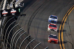 Kurt Busch, Stewart-Haas Racing Ford, takes the checkered flag in front of Ryan Blaney, Wood Brothers Racing Ford and A.J. Allmendinger, JTG Daugherty Racing Chevrolet
