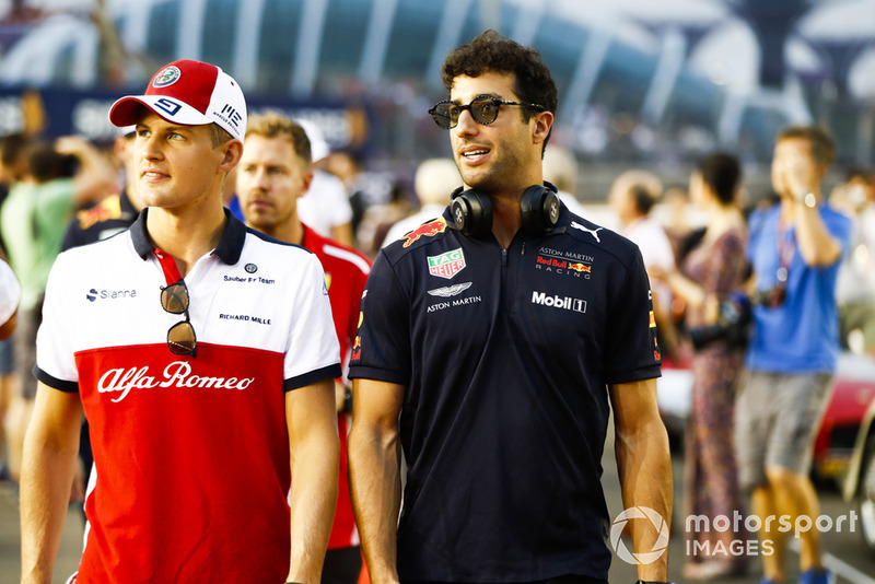 Marcus Ericsson, Sauber, and Daniel Ricciardo, Red Bull Racing, at the drivers parade