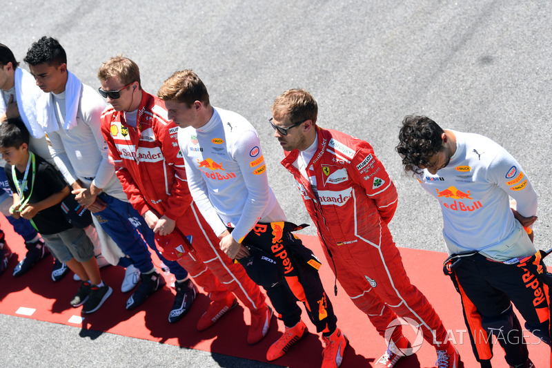 Drivers observe the National Anthem