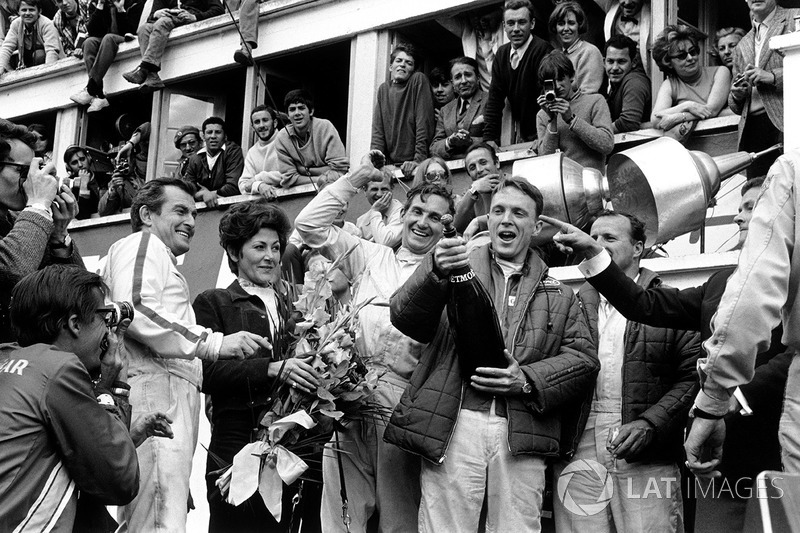 Podium: winners A.J. Foyt, Dan Gurney, second place Ludovico Scarfiotti, Mike Parks. This was the first time champagne was sprayed in celebration on a podium.