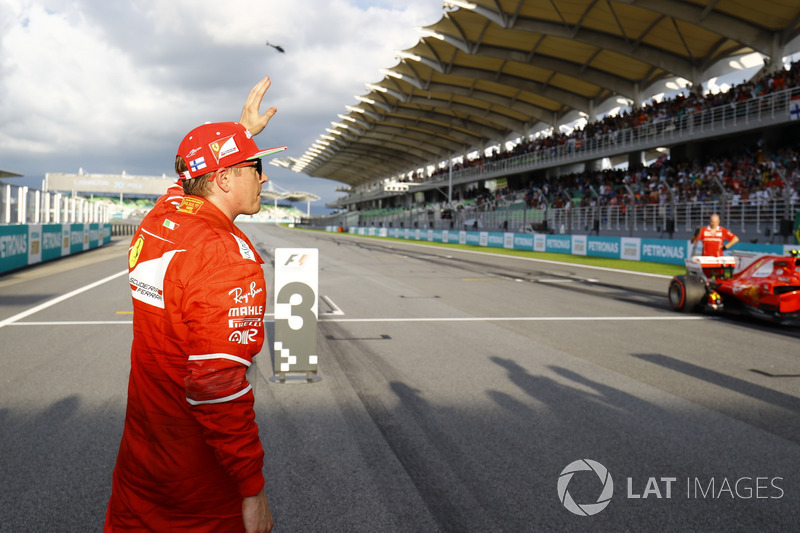 Kimi Raikkonen, Ferrari, waves to fans after qualifying second