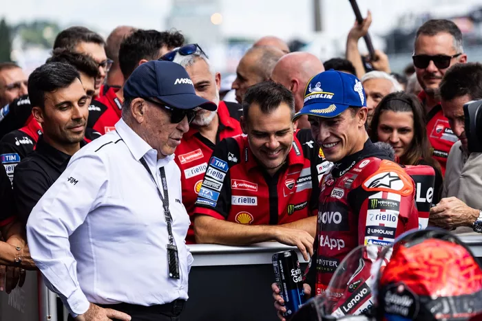 Carmelo Ezpeleta, CEO of Dorna Sports; Marc Marquez; Ducati Team
