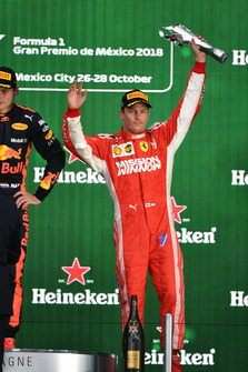 Kimi Raikkonen, Ferrari celebrates on the podium with the trophy