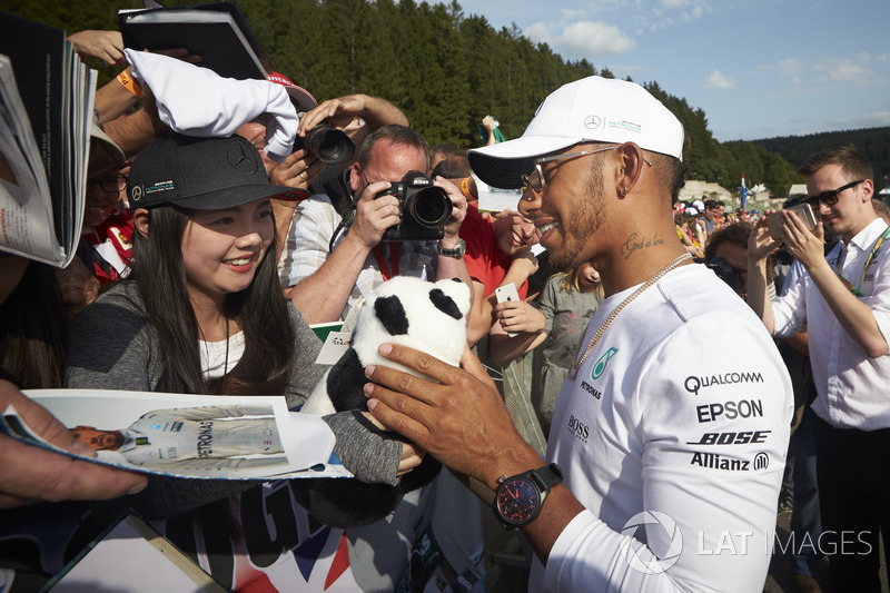 Lewis Hamilton, Mercedes AMG F1, signs autographs for fans