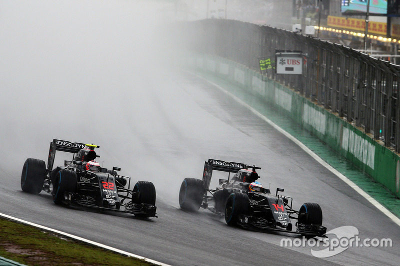 (L to R): Jenson Button, McLaren MP4-31 and team mate Fernando Alonso, McLaren MP4-31 battle for pos