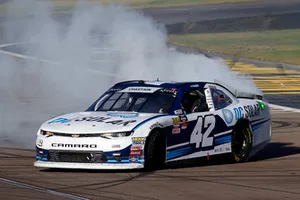 Ross Chastain, Chip Ganassi Racing, Chevrolet Camaro DC Solar celebrates his win with a burnout