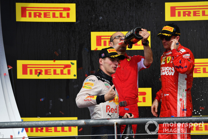 (L to R): Max Verstappen, Red Bull Racing, Carlo Santi, Ferrari Race Engineer and Race Winner Kimi Raikkonen, Ferrari celebrate with the champagne on the podium with the trophy