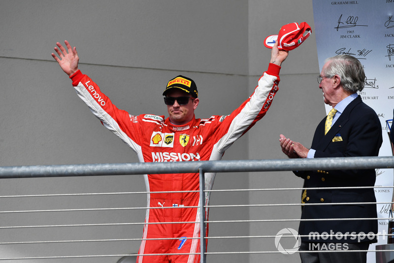 Race winner Kimi Raikkonen, Ferrari celebrates on the podium