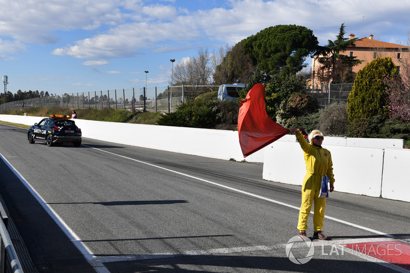 Marshal waves the red flag