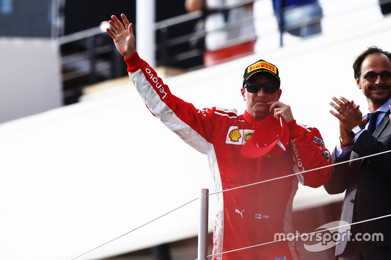 Kimi Raikkonen, Ferrari, celebrates on the podium