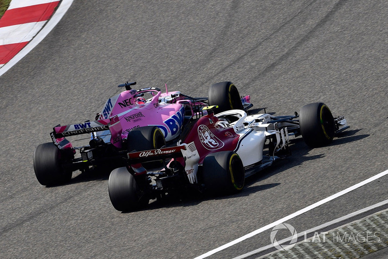 Charles Leclerc, Sauber C37 and Sergio Perez, Force India VJM11