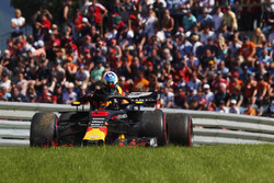 Daniel Ricciardo, Red Bull Racing, exits his car after retiring