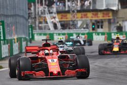 Sebastian Vettel, Ferrari SF71H, leads Valtteri Bottas, Mercedes AMG F1 W09