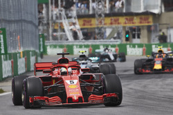 Sebastian Vettel, Ferrari SF71H, leads Valtteri Bottas, Mercedes AMG F1 W09