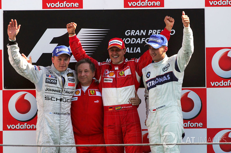 Podium: second place Kimi Raikkonen, McLaren, Jean Todt, Ferrari Sporting Director, race winner Michael Schumacher, Ferrari and third place Robert Kubica, BMW Sauber F1