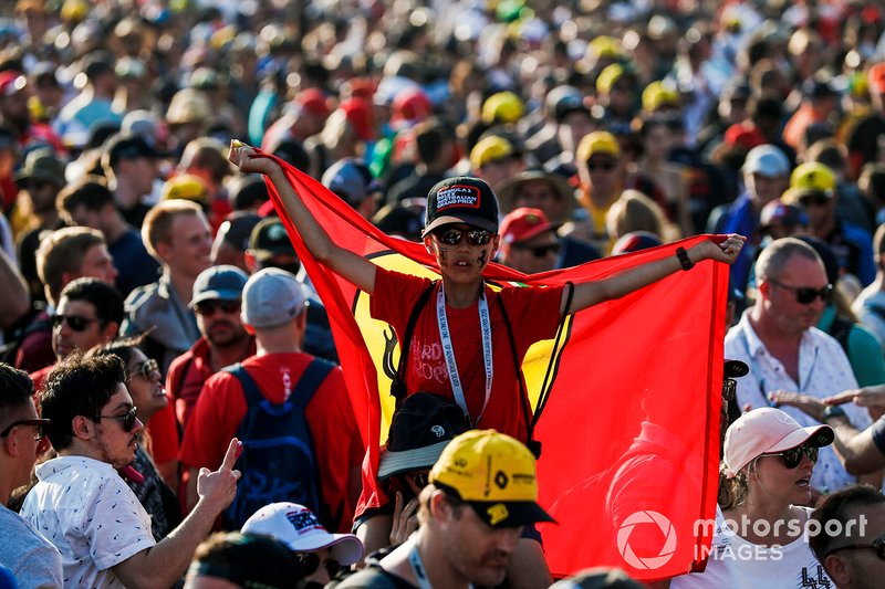 Fans flood the circuit after the race