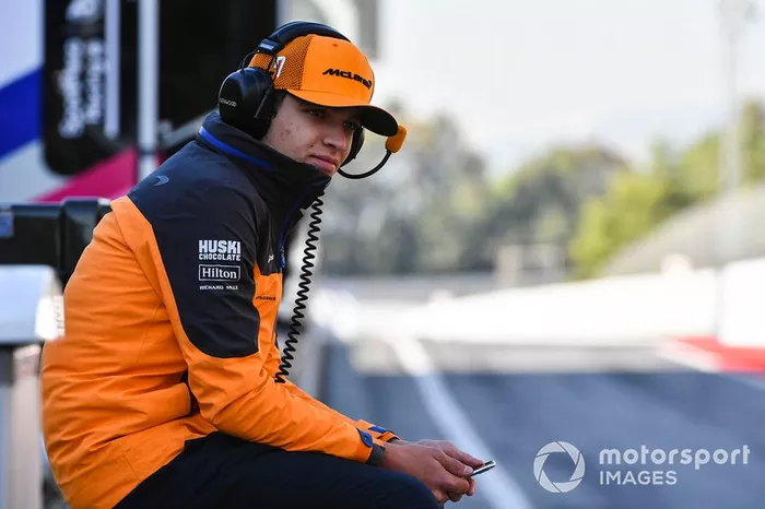 Lando Norris, McLaren sits on the pit wall