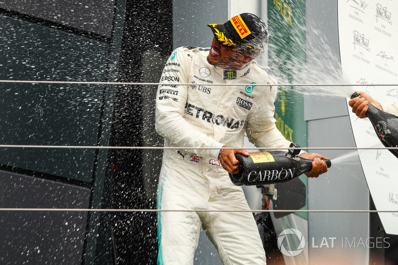 Lewis Hamilton, Mercedes AMG F1 celebrates on the podium, the champagne